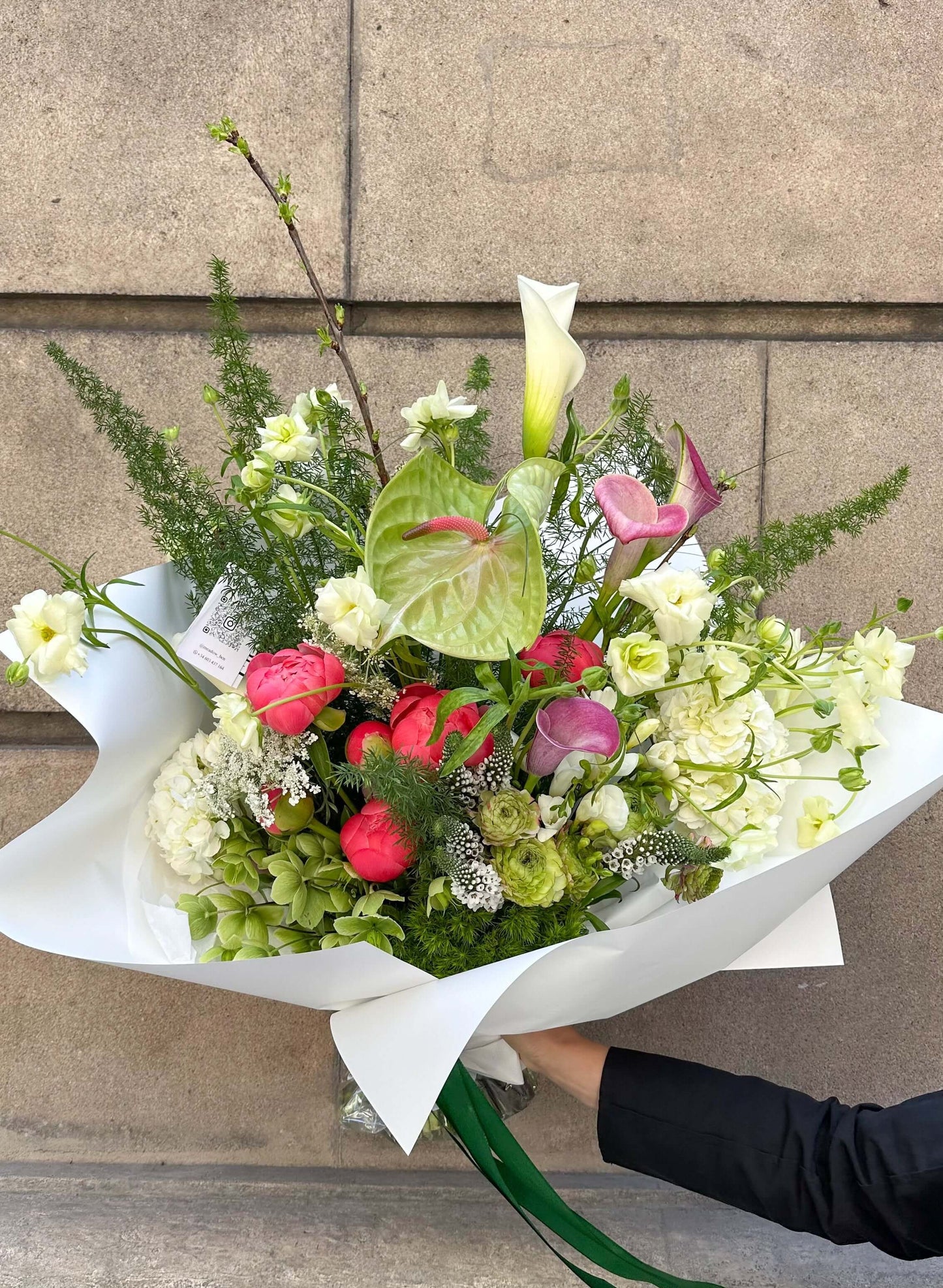 Bouquet of Ranunculus Butterfly, Peony Coral Charm, and Hydrangea by Meadow, available in Barcelona
